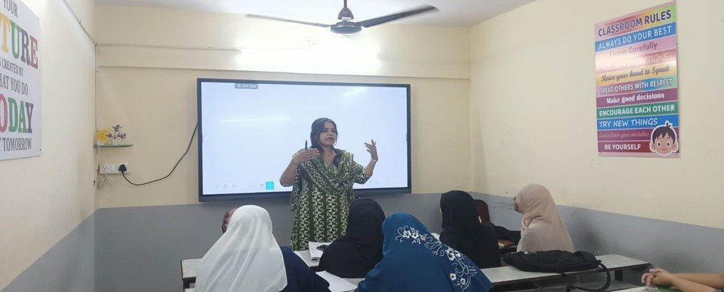 A Vista Academy teacher explaining a concept to students